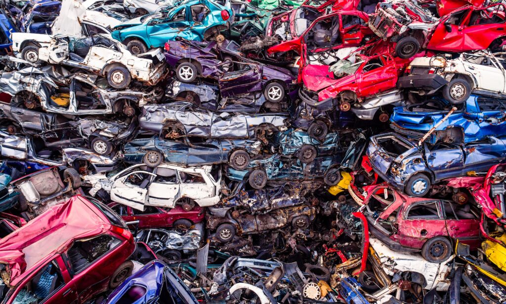 Scrapped Cars Stacked On A Scrap Yard.